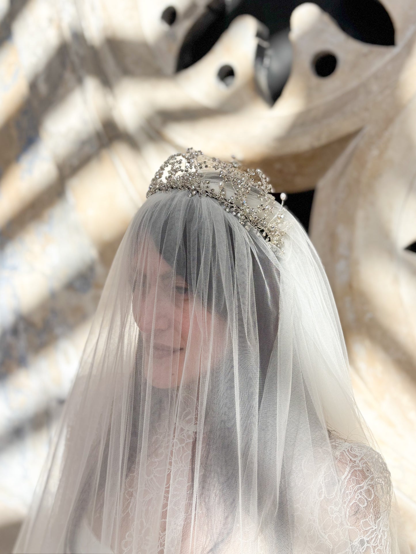 Bride wearing a Wuthering Heights tiara wearing with a veil and tiara.